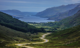 Winding road down to a village on the waters edge Ross Woodhall - Action & Lifestyle Photography