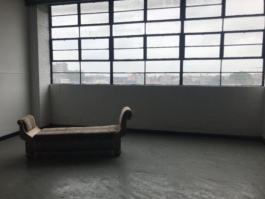 Old warehouse style room with a chaise lounge Ross Woodhall - Action & Lifestyle Photography